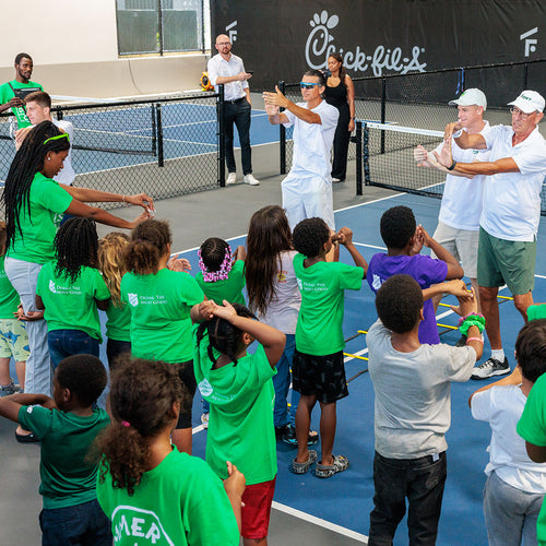 Kids participating in a youth pickleball clinic and group activity at The Fort in Fort Lauderdale.